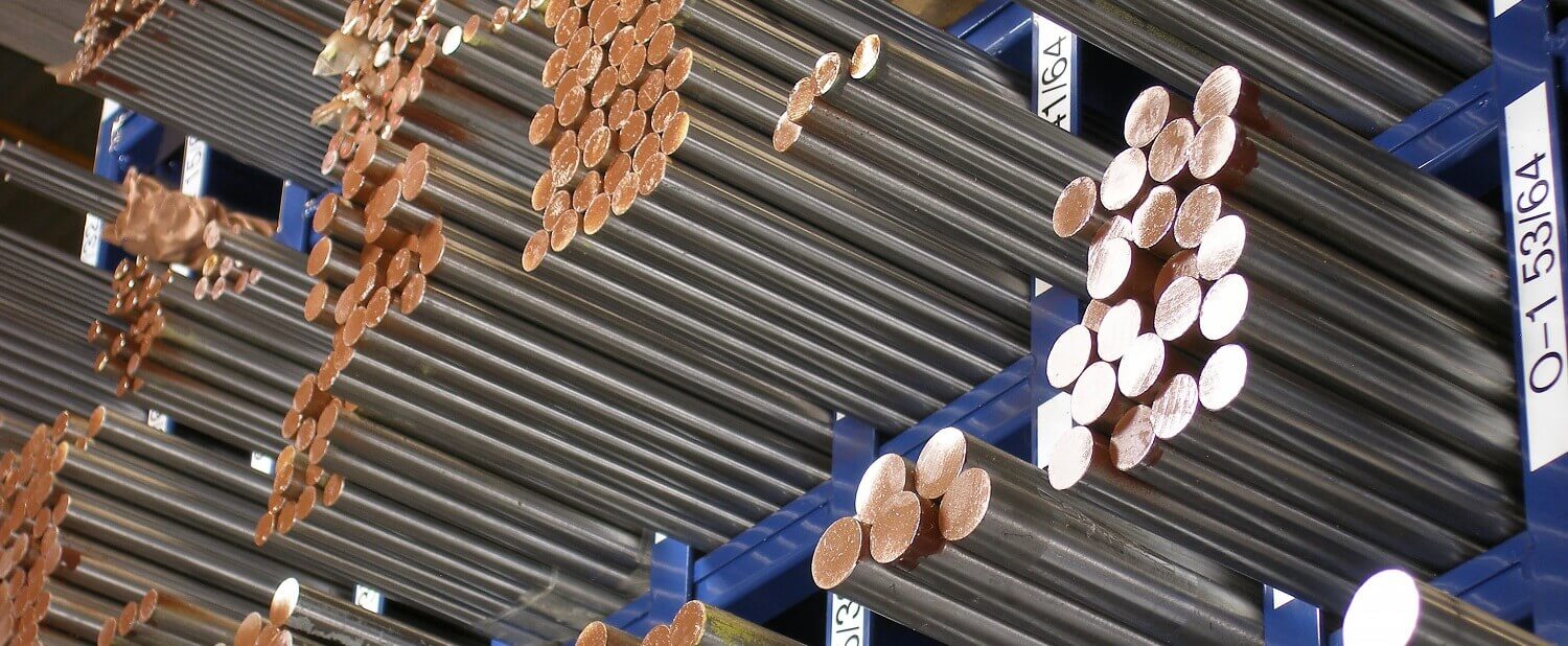 assortment of steel beams in warehouse storage.